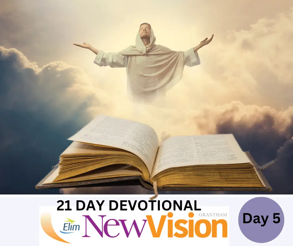Devotional booklet with spiritual figure and open Bible.