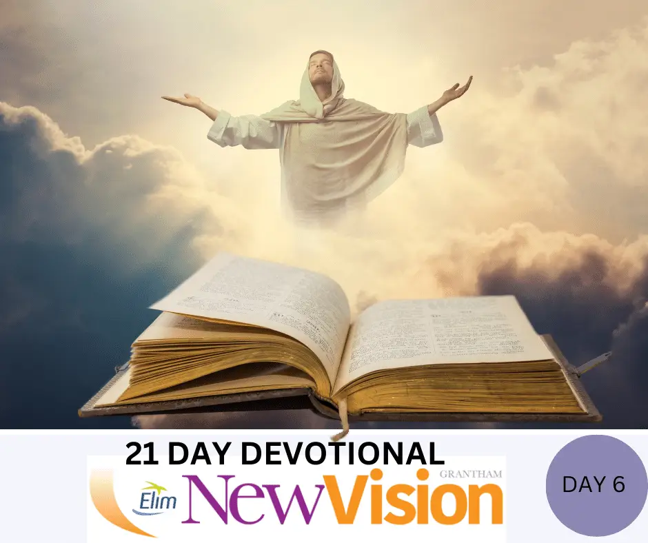 Inspirational devotional book with spiritual figure and clouds.
