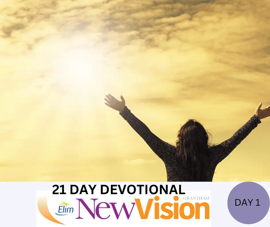 Person raising arms to sky in devotion, day 1.