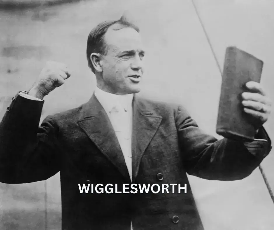 Man holding book and raising fist